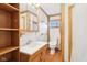 Bathroom with a toilet, sink, and shelves at 8190 Jordan Ln, Indianapolis, IN 46240