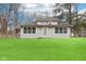 A charming single-story home features a well-manicured lawn and ample natural light at 8190 Jordan Ln, Indianapolis, IN 46240