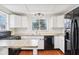 Functional kitchen equipped with updated appliances, ample counter space, and classic white cabinets at 8190 Jordan Ln, Indianapolis, IN 46240
