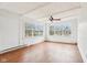 This room features wood floors, large windows, and white paneled walls creating a bright and open atmosphere at 8190 Jordan Ln, Indianapolis, IN 46240
