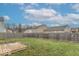 Spacious, green backyard with a wooden deck and a privacy fence, perfect for outdoor entertaining at 8444 Ash Grove Dr, Camby, IN 46113
