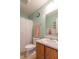 Bathroom features a large mirror, shower with patterned curtain, and wood cabinets at 8444 Ash Grove Dr, Camby, IN 46113