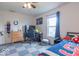 The bedroom features unique checkered carpets, gaming setup, closet door, and a single bed at 8444 Ash Grove Dr, Camby, IN 46113