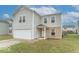 Charming two-story home with a neatly maintained lawn and a front-facing garage at 8444 Ash Grove Dr, Camby, IN 46113