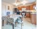 This kitchen has wooden cabinets, stainless steel appliances, and a large dining table nearby at 8444 Ash Grove Dr, Camby, IN 46113