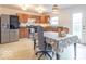 Well-lit kitchen with modern appliances and an adjacent dining area for Gathering meals at 8444 Ash Grove Dr, Camby, IN 46113
