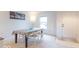 Bright living room with natural light featuring a table, chairs and neutral decor at 8444 Ash Grove Dr, Camby, IN 46113
