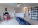 Spacious loft area with comfortable seating, built-in shelving, and neutral colored walls at 8444 Ash Grove Dr, Camby, IN 46113