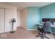 Home office features a dual monitor setup, a rolling office chair and a window at 8444 Ash Grove Dr, Camby, IN 46113