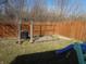 Enclosed backyard featuring a wooden fence, grass and play structure at 8848 Hosta Way, Camby, IN 46113