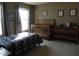 Cozy bedroom featuring a bed, crib, dresser, and decor under natural lighting at 8848 Hosta Way, Camby, IN 46113