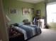 Bedroom featuring blue color, a bed, window, and a view into connecting room at 8848 Hosta Way, Camby, IN 46113