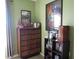 Bedroom with side cabinet, records, and vintage decor under natural lighting at 8848 Hosta Way, Camby, IN 46113