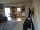 Open-concept living room featuring a spacious layout with a dining area adjacent to the kitchen at 8848 Hosta Way, Camby, IN 46113