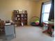 Bright office space featuring a desk, shelving, and a window for natural light at 8848 Hosta Way, Camby, IN 46113