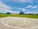Outdoor basketball court with well-maintained court lines, hoop, and residential houses in the background at 9034 Faulkner Dr, Indianapolis, IN 46239