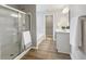 Modern bathroom with a glass-enclosed shower and double sink vanity at 9034 Faulkner Dr, Indianapolis, IN 46239