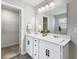Bathroom with double vanity sinks, closet, and neutral finishes at 9034 Faulkner Dr, Indianapolis, IN 46239