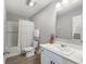 A well-lit bathroom features a white vanity, modern fixtures, and a shower-tub combo at 9034 Faulkner Dr, Indianapolis, IN 46239