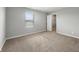 An inviting bedroom has neutral walls, plush carpet, and a walk-in closet for convenience at 9034 Faulkner Dr, Indianapolis, IN 46239