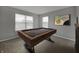 Game room featuring a modern pool table and bright windows with natural light at 9034 Faulkner Dr, Indianapolis, IN 46239