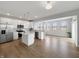 Open-concept kitchen with island, stainless steel appliances, and bright lighting at 9034 Faulkner Dr, Indianapolis, IN 46239