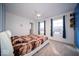 Cozy bedroom with natural light and white ceiling fan at 10202 Meadow Path Ln, Indianapolis, IN 46239