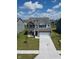 Charming two-story home featuring a two-car garage, dormer windows, and well-manicured landscaping at 10202 Meadow Path Ln, Indianapolis, IN 46239