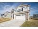 Charming two-story home with a well-maintained lawn and a two-car garage at 10202 Meadow Path Ln, Indianapolis, IN 46239