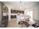 Modern kitchen with stainless steel appliances, island seating, and sliding glass doors at 10202 Meadow Path Ln, Indianapolis, IN 46239