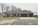 Charming brick ranch-style home with an attached two-car garage and well-manicured landscaping at 1050 Lapwing Ct, Columbus, IN 47203