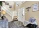 Bright foyer with hardwood floors, a staircase, and stylish decor that complement the space at 10518 Cornelian Ct, Noblesville, IN 46060