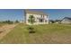 New construction home featuring a large backyard with newly planted tree at 1101 Knoll Ct, Greenwood, IN 46143