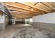 Unfinished basement with concrete floor and walls, exposed ceiling, and a single window at 1101 Knoll Ct, Greenwood, IN 46143