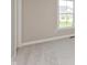View of an empty bedroom with plush neutral carpet, a window, and neutral paint at 1101 Knoll Ct, Greenwood, IN 46143
