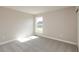 Bedroom featuring a window bringing in natural light and neutral carpeting and paint at 1101 Knoll Ct, Greenwood, IN 46143