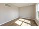 Bright bedroom featuring hard wood floors, neutral walls, recessed lighting, and a large window at 1101 Knoll Ct, Greenwood, IN 46143
