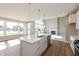 Bright open kitchen with stainless steel appliances and natural light, adjacent to living area at 1101 Knoll Ct, Greenwood, IN 46143