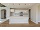 Modern kitchen with white cabinets, stainless steel appliances, and quartz countertops at 1101 Knoll Ct, Greenwood, IN 46143