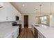Modern kitchen featuring white cabinets, stainless steel appliances, and a large island at 1101 Knoll Ct, Greenwood, IN 46143