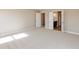 View of the main bedroom with neutral paint, plush carpet, and an adjoining bathroom and closet at 1101 Knoll Ct, Greenwood, IN 46143