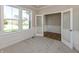 Office featuring gray carpet, panelled walls, and french doors leading into another room at 1101 Knoll Ct, Greenwood, IN 46143