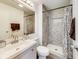 Bathroom with a white vanity, toilet, and tiled shower at 11410 Dunshire Dr, Indianapolis, IN 46229