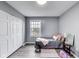 bedroom with grey walls, wood floors, and a closet at 11410 Dunshire Dr, Indianapolis, IN 46229