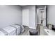 Bedroom featuring grey walls, wood floors, a closet, and a desk at 11410 Dunshire Dr, Indianapolis, IN 46229