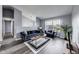 Inviting living room featuring a modern sofa, neutral walls, and large windows for plenty of natural light at 11410 Dunshire Dr, Indianapolis, IN 46229