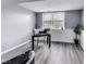 Office space with hardwood flooring and a black desk and chair, offering a simple and functional workspace at 11410 Dunshire Dr, Indianapolis, IN 46229