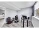 Home office with stylish seating, desk, and natural light offers a productive workspace at 11410 Dunshire Dr, Indianapolis, IN 46229
