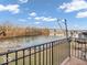 Scenic view of the calm lake and surrounding landscape from the private balcony at 11936 Esty Way, Carmel, IN 46033