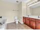 Bathroom showcasing a double vanity, tile flooring, and a combination tub and shower at 11936 Esty Way, Carmel, IN 46033